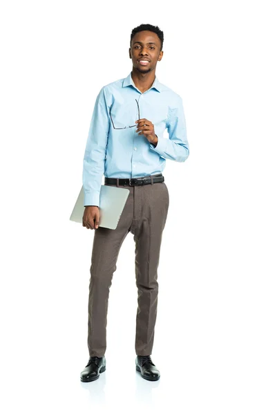 Happy african american college student with laptop standing on w — Stock Photo, Image