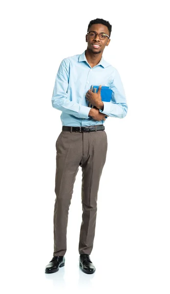 Happy african american college student with books standing on wh — Stock Photo, Image