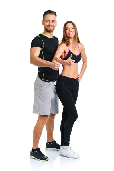 Sportlicher Mann und Frau nach Fitnessübung mit erhobenem Finger — Stockfoto