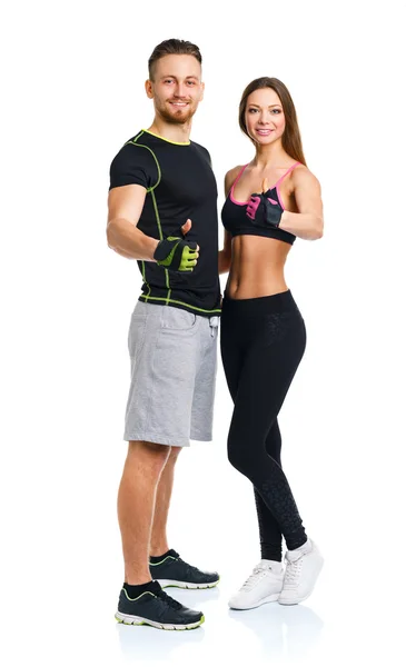 Athletic man and woman after fitness exercise with a finger up o — Stock Photo, Image