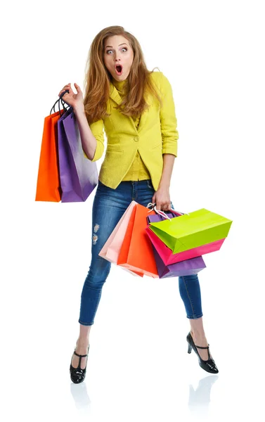 Mulher encantadora feliz com sacos de compras sobre branco — Fotografia de Stock
