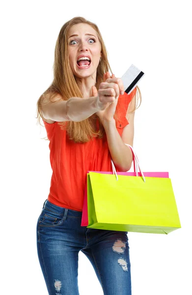 Mujer encantadora feliz con bolsas de compras y tarjeta de crédito sobre blanco — Foto de Stock