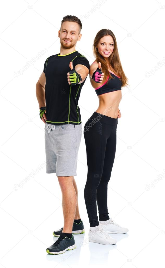 Athletic man and woman after fitness exercise with a finger up o