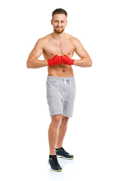 Atlético atraente homem vestindo bandagens de boxe no branco — Fotografia de Stock