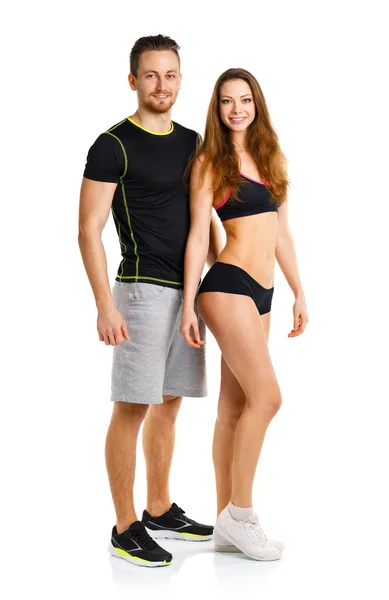 Athletic man and woman after fitness exercise on the white — Stock Photo, Image