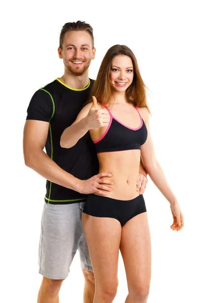Athletic man and woman after fitness exercise with a finger up o — Stock Photo, Image