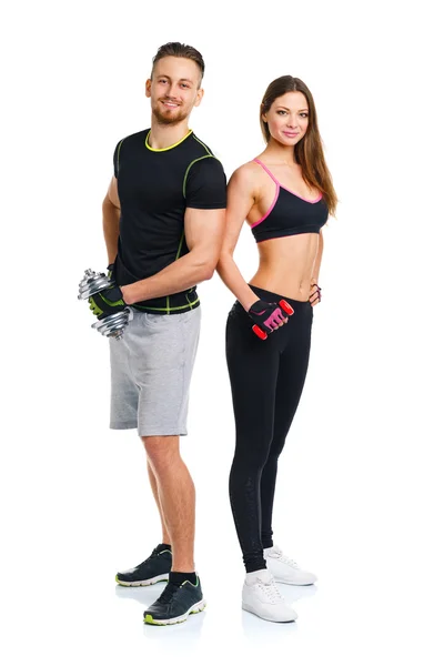 Pareja deportiva - hombre y mujer con mancuernas en el blanco — Foto de Stock