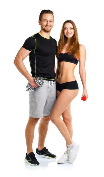 Sport couple - man and woman with dumbbells on the white — Stock Photo, Image