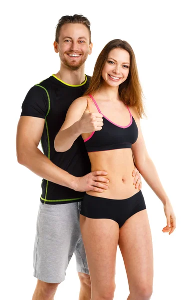 Athletic man and woman after fitness exercise with thumbs up on — Stock Photo, Image