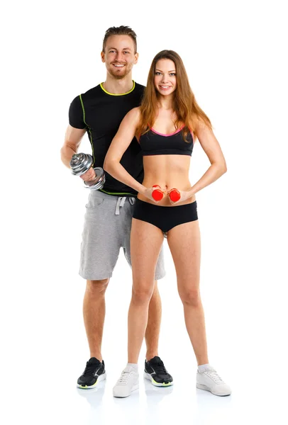 Sport paar - man en vrouw met halters op de witte — Stockfoto