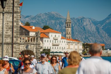 HISTORICAL CITY OF PERAST, MONTENEGRO: Tourists walk in the hist