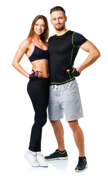 Sportovní pár - muž a žena po fitness cvičení na bílé — Stock fotografie