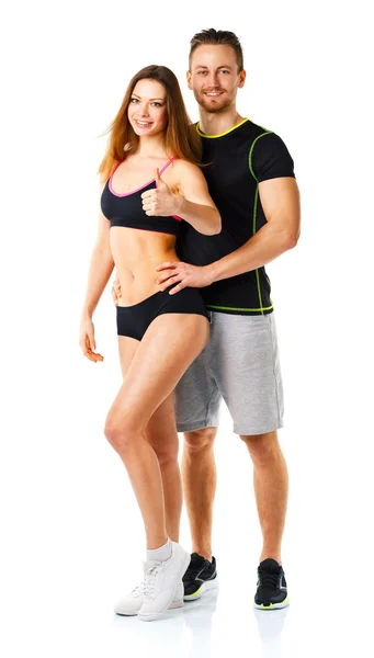 Athletic man and woman after fitness exercise with a thumb up on — Stock Photo, Image