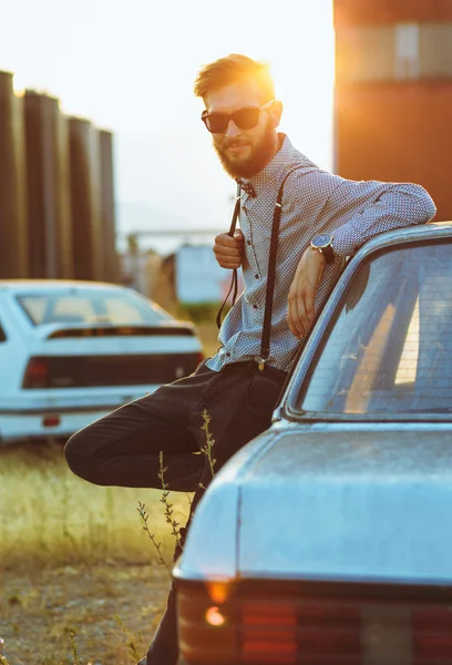 Portrait of a young handsome stylish man, wearing shirt and bow- — Stock Photo, Image