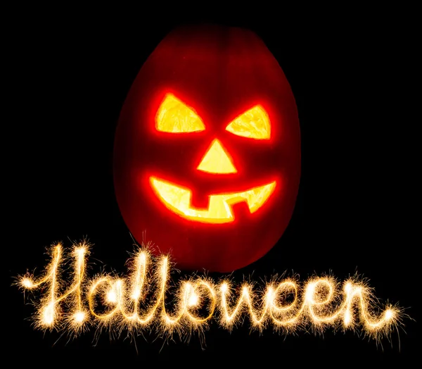 Halloween zucca jack-o-lanterna candela accesa e l'iscrizione — Foto Stock