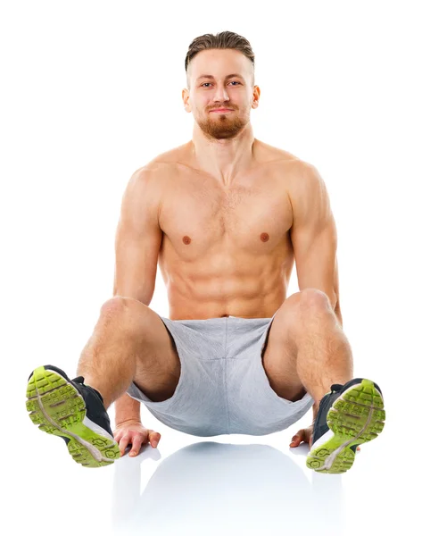 Sport attractive man doing fitness exercises on the white — Stock Photo, Image