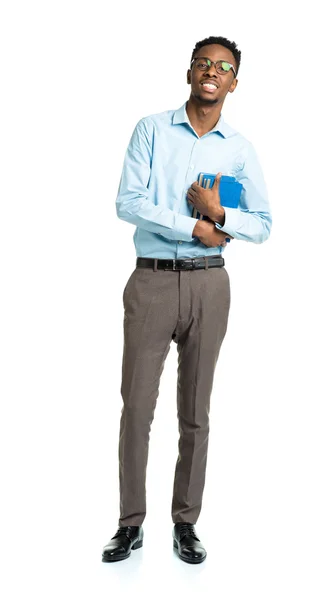 Happy african american college student with books in his hands — Stock Photo, Image