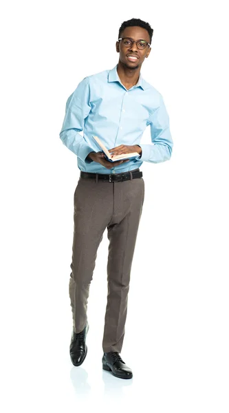 Happy african american college student with books in his hands — Stock Photo, Image