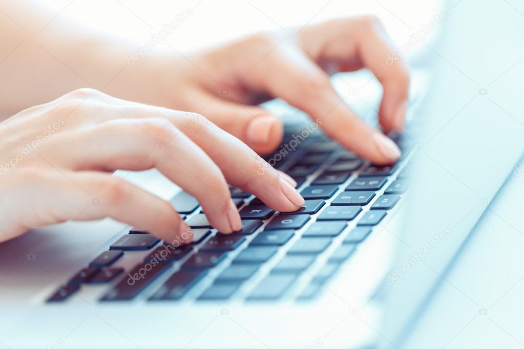 Female hands or woman office worker typing on the keyboard