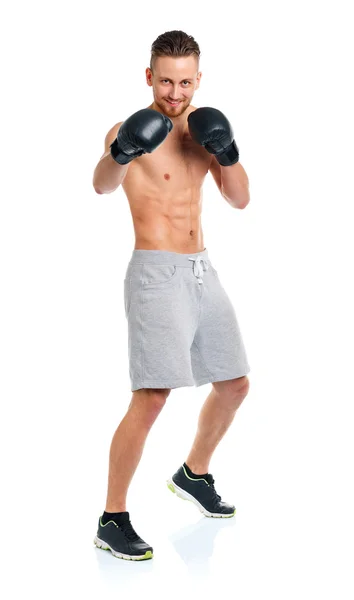 Deporte atractivo hombre usando guantes de boxeo en el blanco —  Fotos de Stock