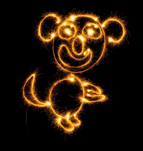 Monkey made sparklers on black — Stock Photo, Image