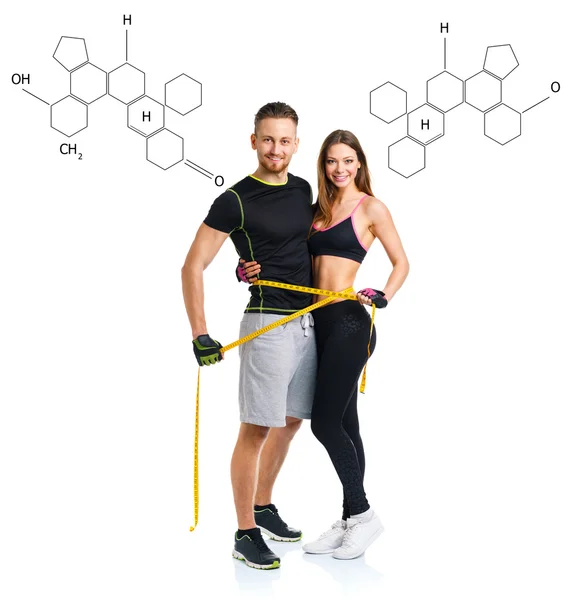 Счастливая атлетическая пара - мужчина и женщина с измерительной лентой с т — стоковое фото