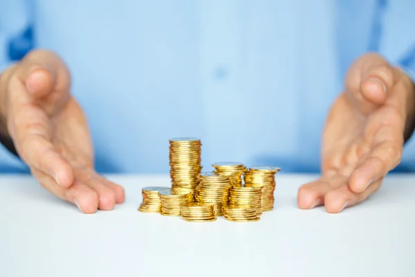 Protect new business start-up concept with hands and coin — Stock Photo, Image