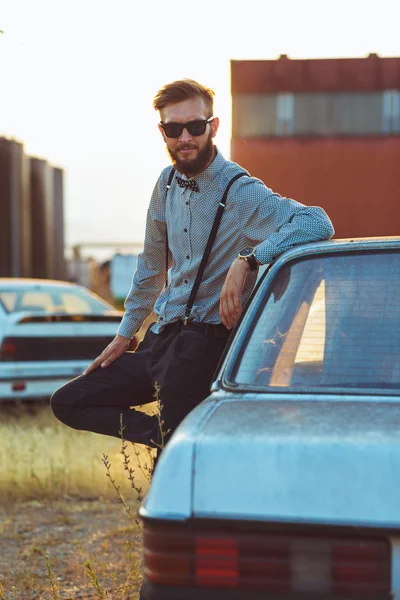 Young handsome stylish man, wearing shirt and bow-tie with old c — Stock Photo, Image