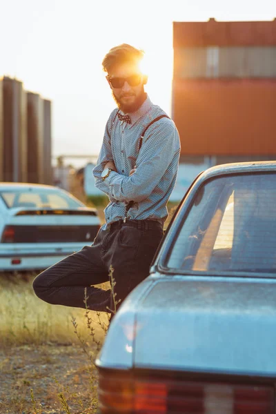 Young handsome stylish man, wearing shirt and bow-tie with old c — Stock Photo, Image