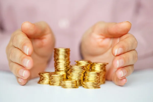 Protect new business start-up concept with hands and coin — Stock Photo, Image