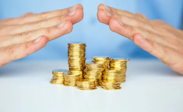 Protect new business start-up concept with hands and coin — Stock Photo, Image