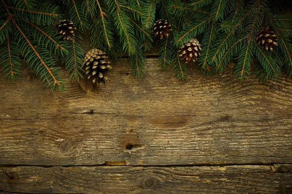 Boże Narodzenie drzewo gałęzie na drewniane tekstury — Zdjęcie stockowe