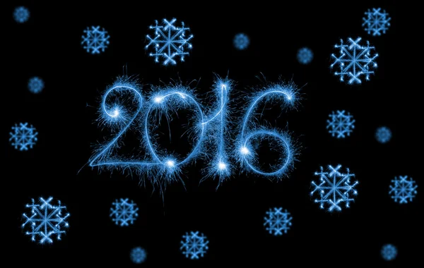 Happy New Year - 2016 with snowflakes made by sparklers on black