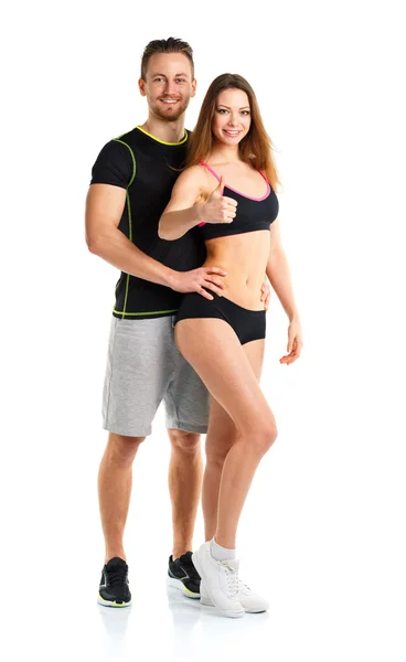Hombre y mujer atléticos después del ejercicio físico con los pulgares hacia arriba en —  Fotos de Stock
