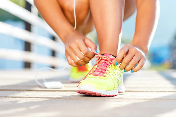 Running shoes - woman tying shoe laces — Stock Photo, Image