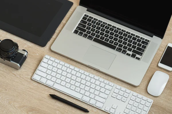 Business workplace with laptop and gadgets — Stock Photo, Image