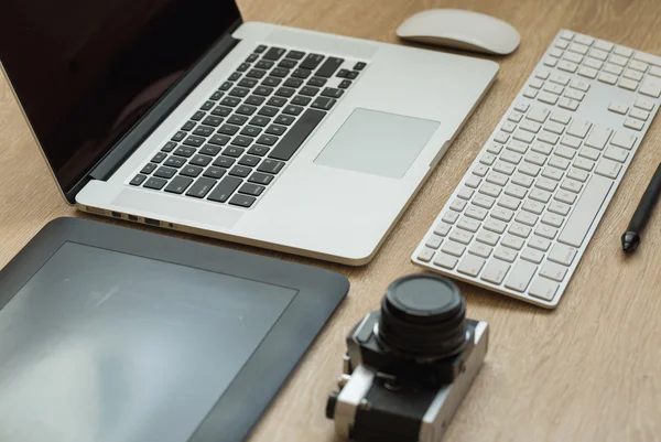 Business workplace with laptop and gadgets — Stock Photo, Image