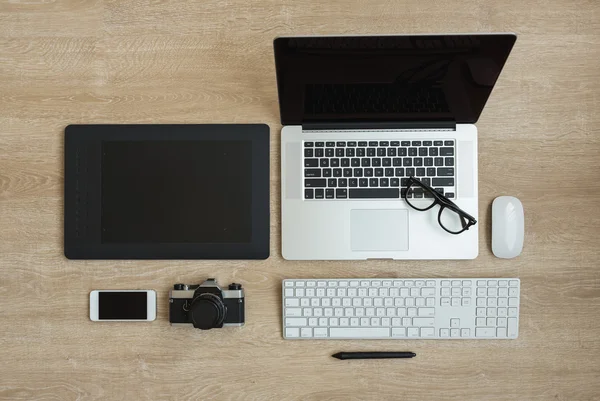 Top view of business workplace with laptop and gadgets — Stock Photo, Image