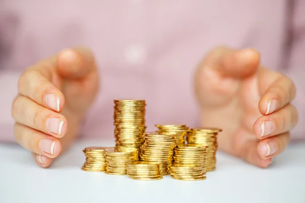 Protect business start-up concept - with hands and coin — Stock Photo, Image