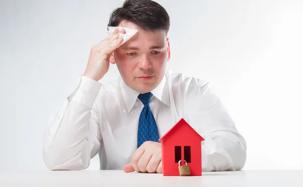 Sad Man with a red paper house — Stock Photo, Image