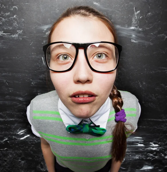 Girl near blackboard — Stock Photo, Image