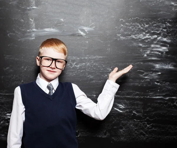 Boy near blackboard — Stock Photo, Image