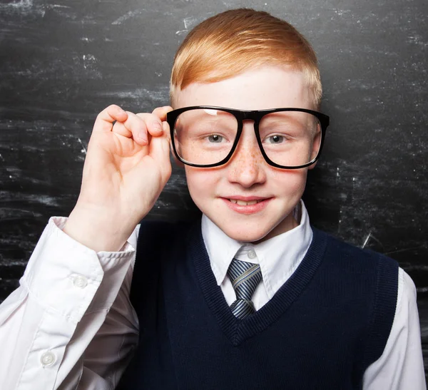 Boy near blackboard — Stock Photo, Image