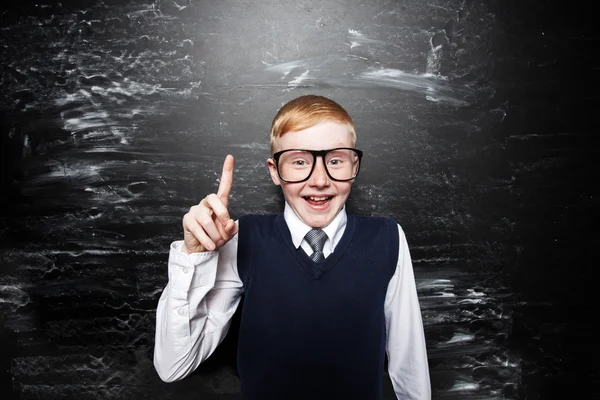 Boy near blackboard — Stock Photo, Image