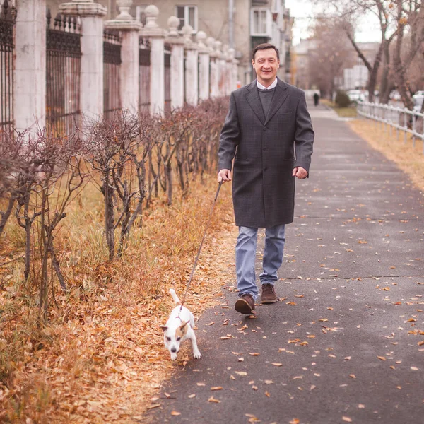 Man walks with his dog