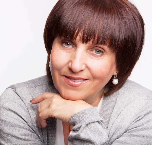 Smiling mature woman. Happy female. Studio shot