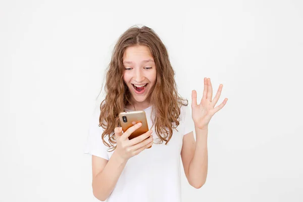 Surprised Young Girl Using Mobile Phone Positive Expression Smiles Broadly — Stock Photo, Image