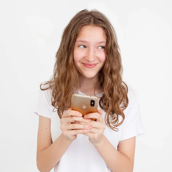 Surprised Young Girl Using Mobile Phone Positive Expression Smiles Broadly — Stock Photo, Image