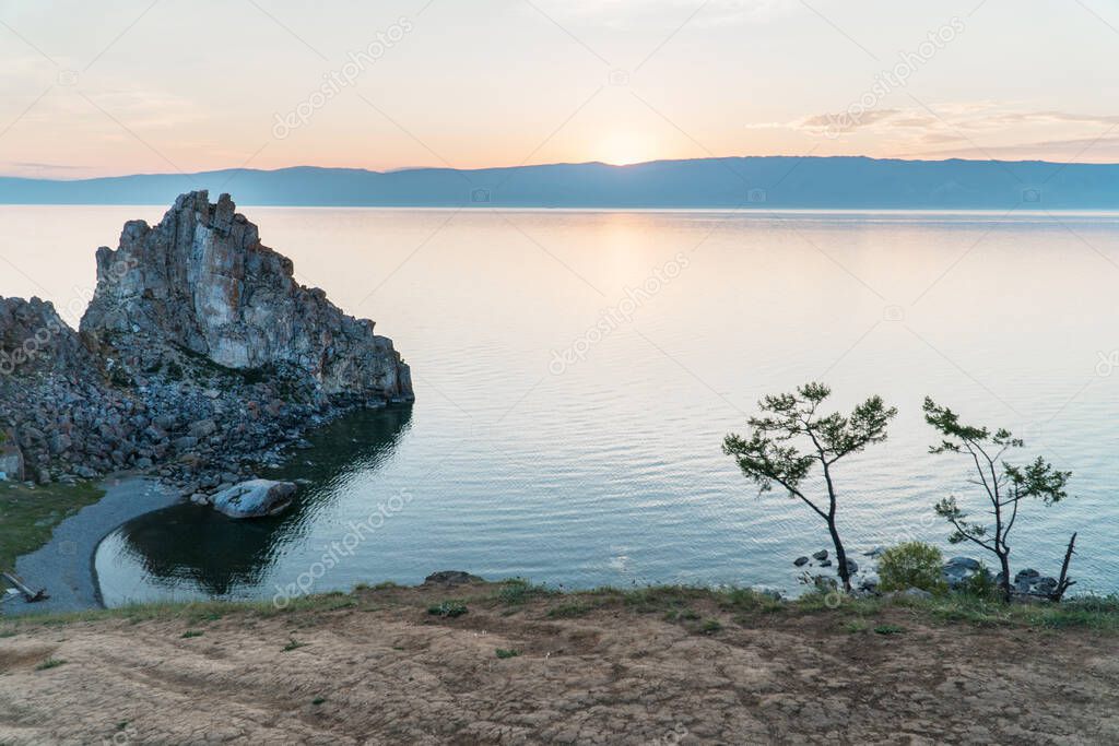 Shamanka Rock on Baikal lake near Khuzhir at Olkhon island in Siberia, Russia. Lake Baikal is the largest freshwater lake in the world