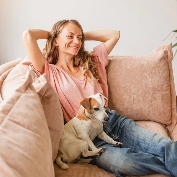 Happy Millennial Girl Dog Sit Relax Comfortable Couch Living Room — 스톡 사진
